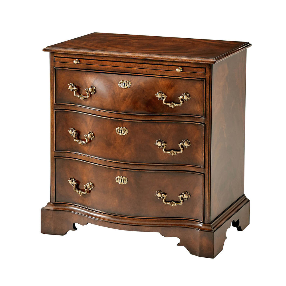 Chippendale mahogany bedside chest, angled view.