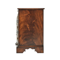 Side view of mahogany bedside chest, grain detail.
