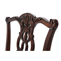 Detailed view of Chippendale mahogany chair top carving.