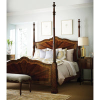 Bright room with mahogany four post bed interior.