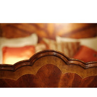 Elegant headboard design on mahogany four post bed.
