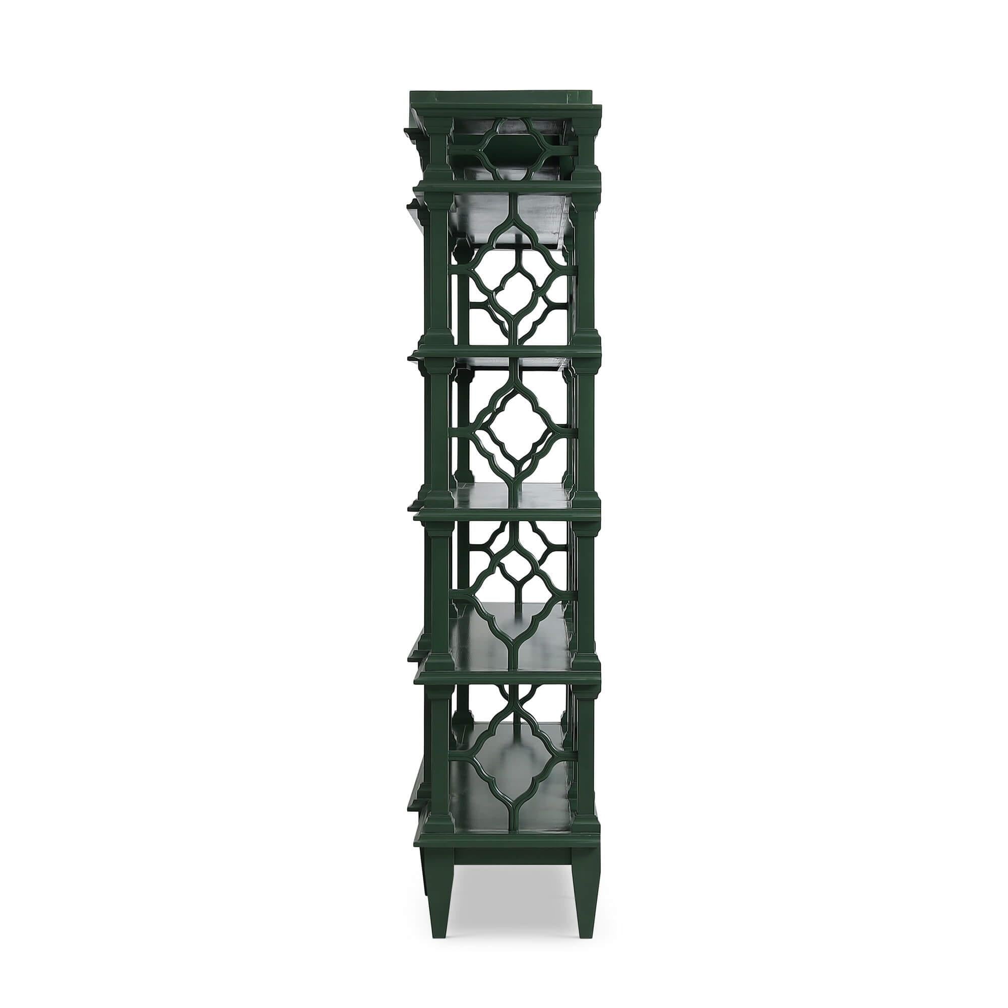 Side profile of emerald green Chippendale bookshelf.
