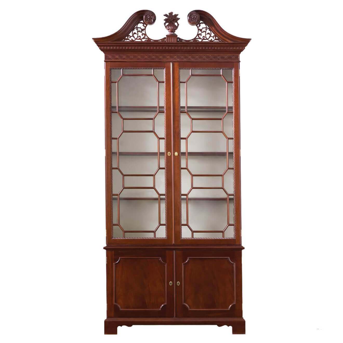 Chippendale-style scroll top bookcase with glass doors.