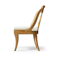Side profile of classic antique dining chair.