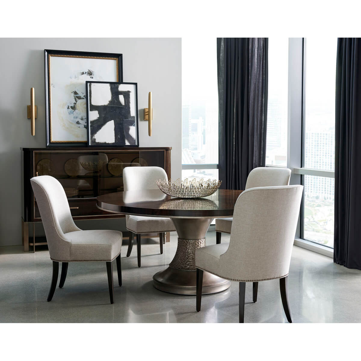 Dining room with art deco chairs, round table arrangement.