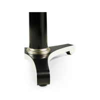 Close-up of pedestal base, classic dining table design.
