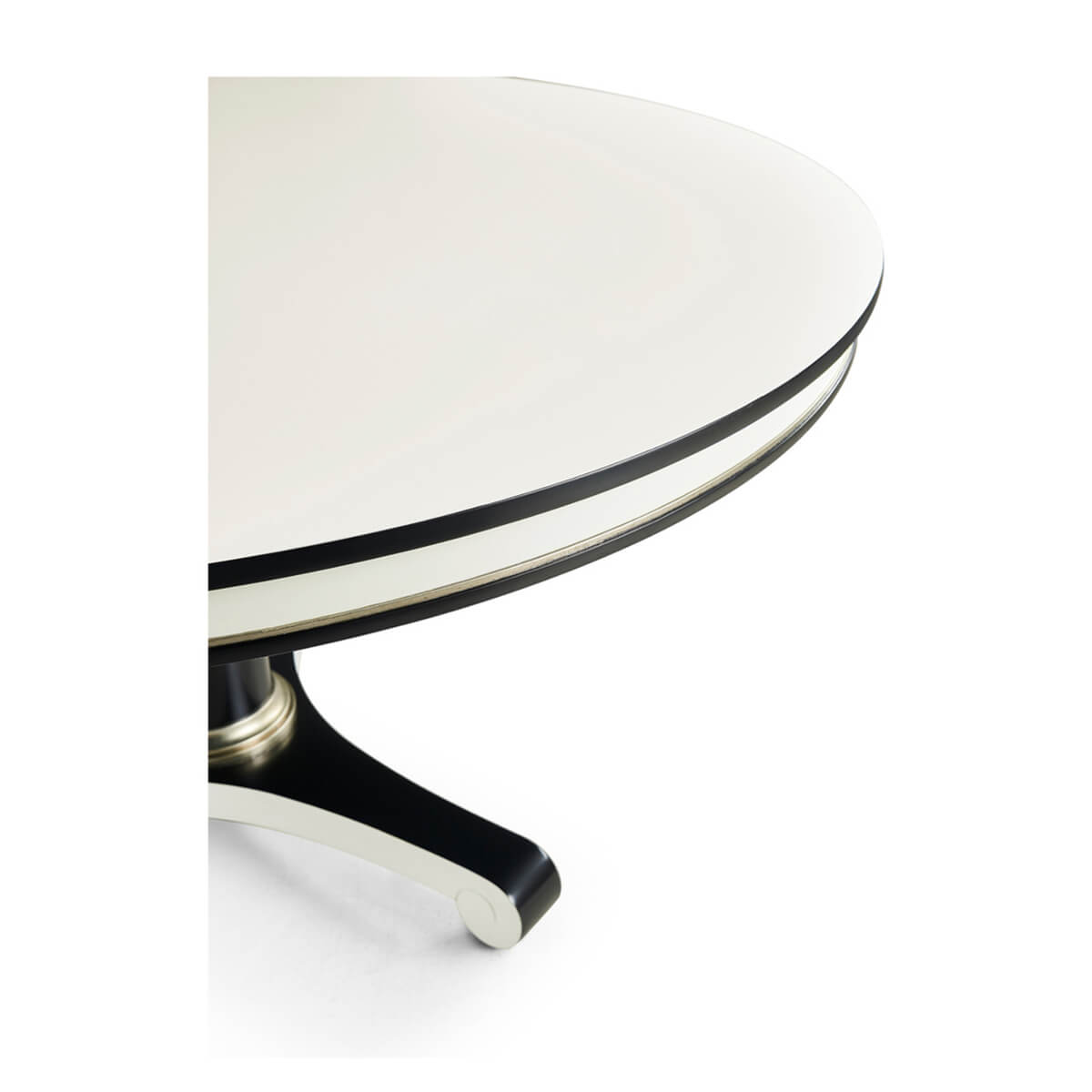 Top view, black trim on round white dining table.