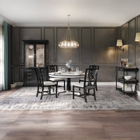 Dining room with black display cabinet and modern decor.