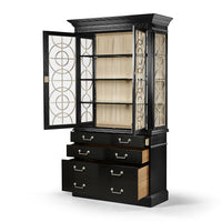 Display cabinet, open doors and drawers, glass shelves.