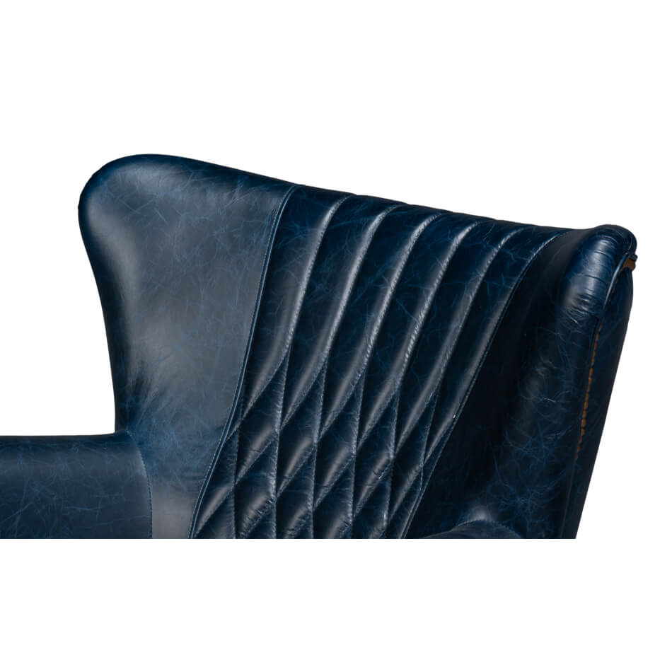 Blue leather swivel chair, close-up, quilted backrest pattern.