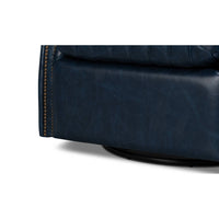 Blue leather swivel chair, base detail, smooth leather finish.