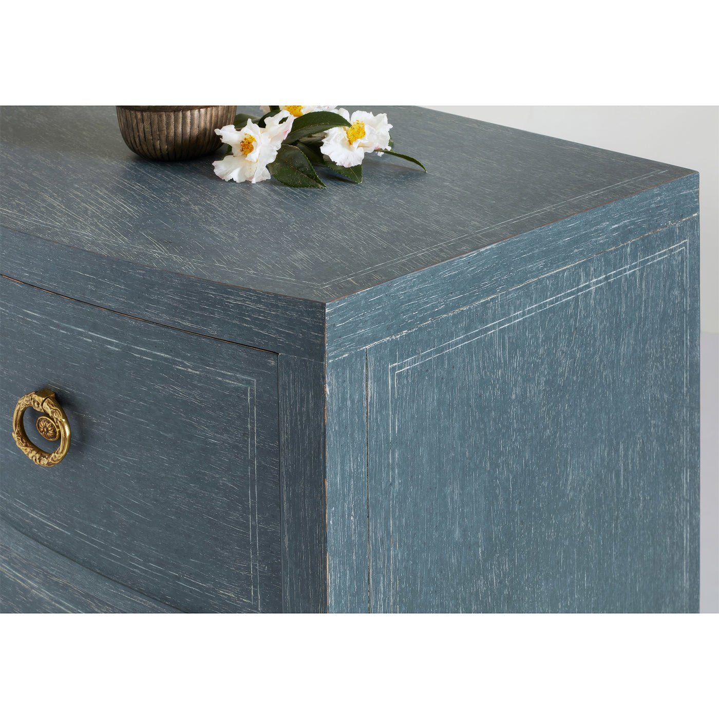 Detailed view of chest's top corner finish and texture.