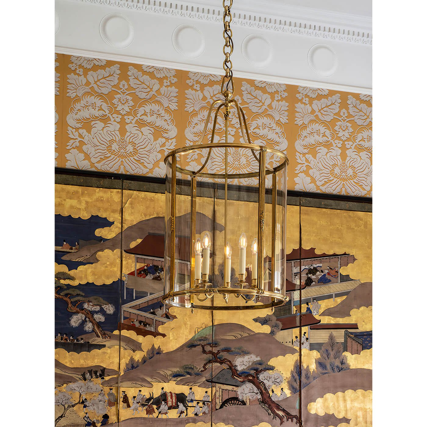 Brass hall lantern in vintage interior setting.