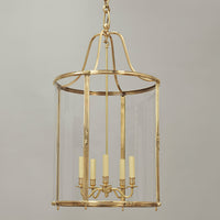 Brass hall lantern close-up with glass panels.