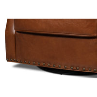 Brown leather swivel armchair base detail.