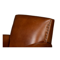 Brown leather swivel armchair top back detail.