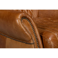 Armrest stitching close-up on brown leather chair