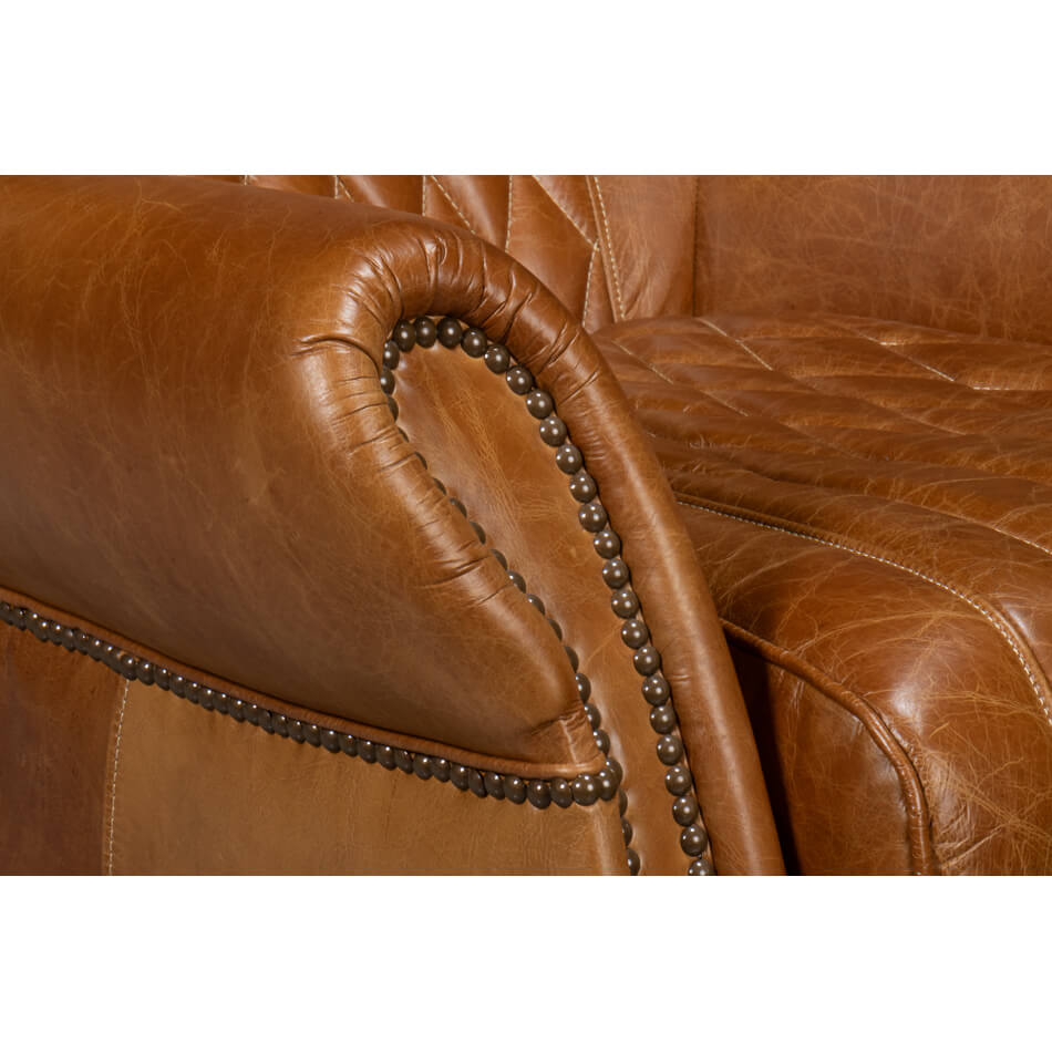 Armrest stitching close-up on brown leather chair