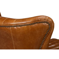 Backrest detail on brown leather swivel chair