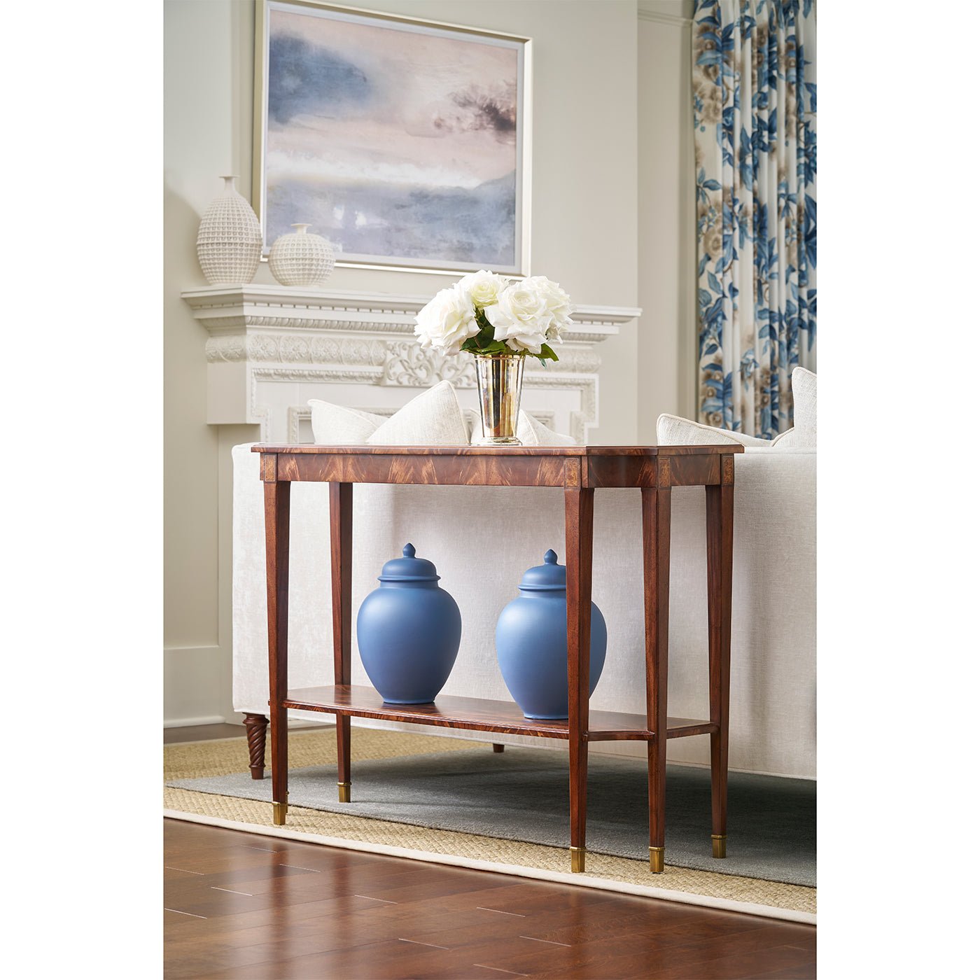 Classic console table styled in living room with decor.