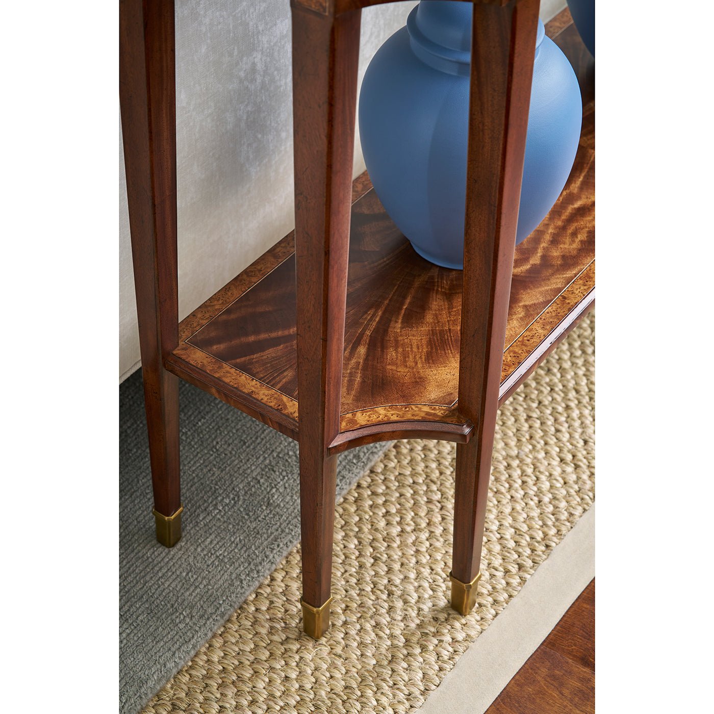 Base of classic console table with blue vase styling.