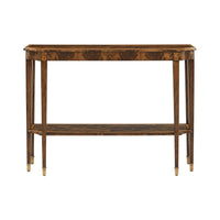 Straight-on view of classic console table with gold accents.