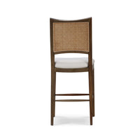 Back view of counter stool, showing woven cane back.