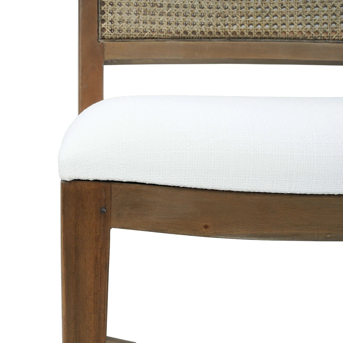 Close-up of cushion on wooden dining chair.
