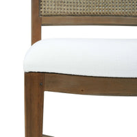 Close-up of cushion on wooden dining chair.