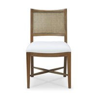 Front view of wooden dining chair with cane back.