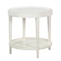 Round white end table with lower shelf, angled view.