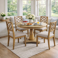 Dining room setup with center table and chairs.