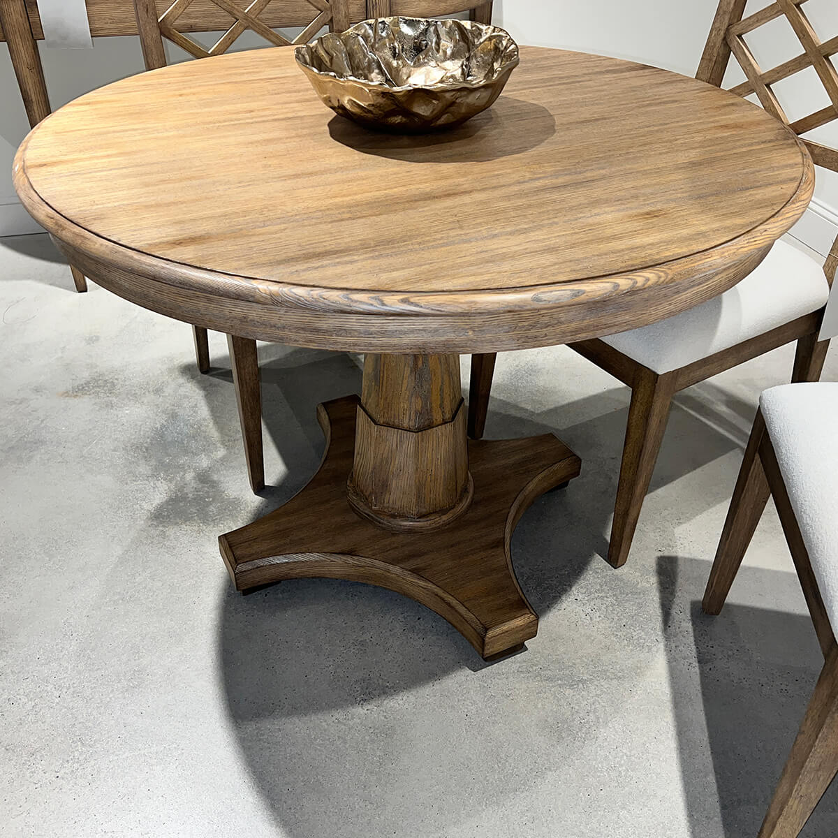 Close-up of wooden center table with chairs.