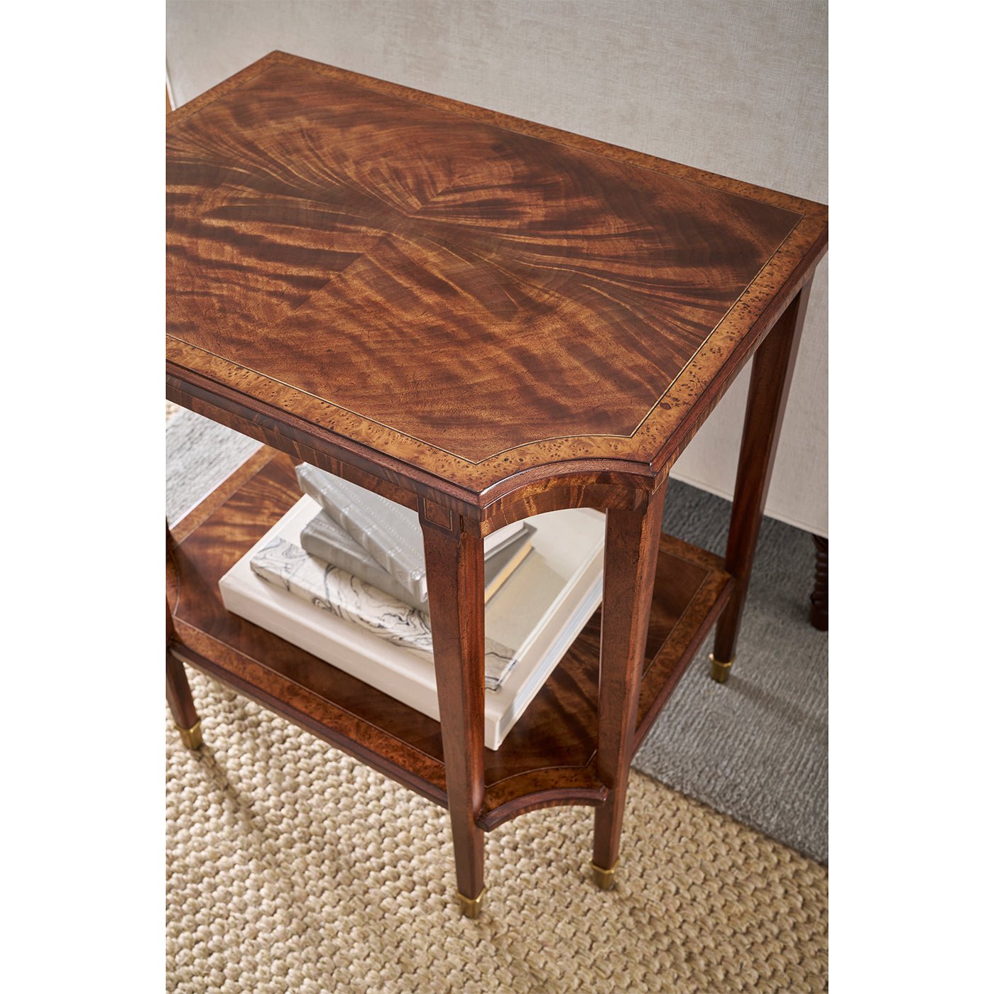 Close-up of end table top with books underneath.