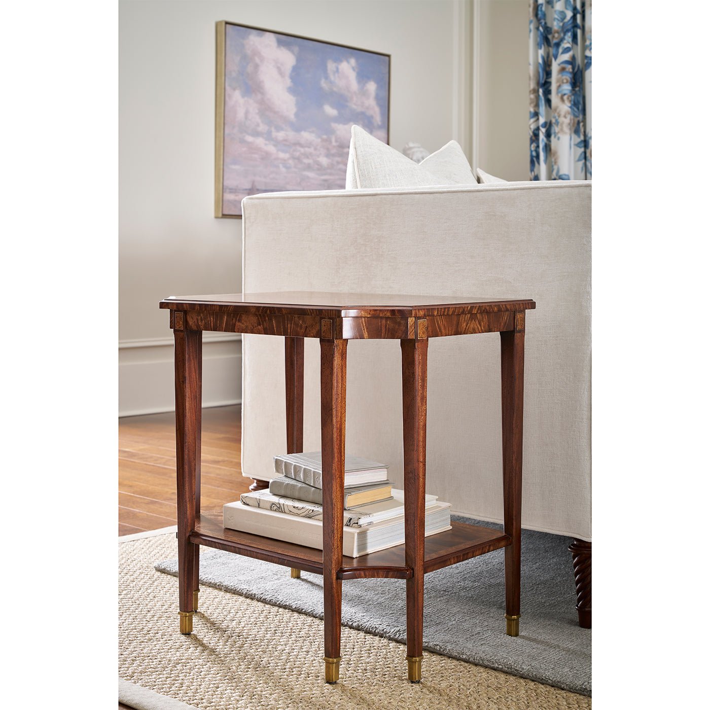End table in living room with books underneath.