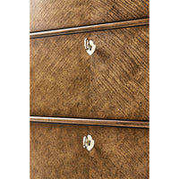 Close-up of drawer handles on English tall dresser.