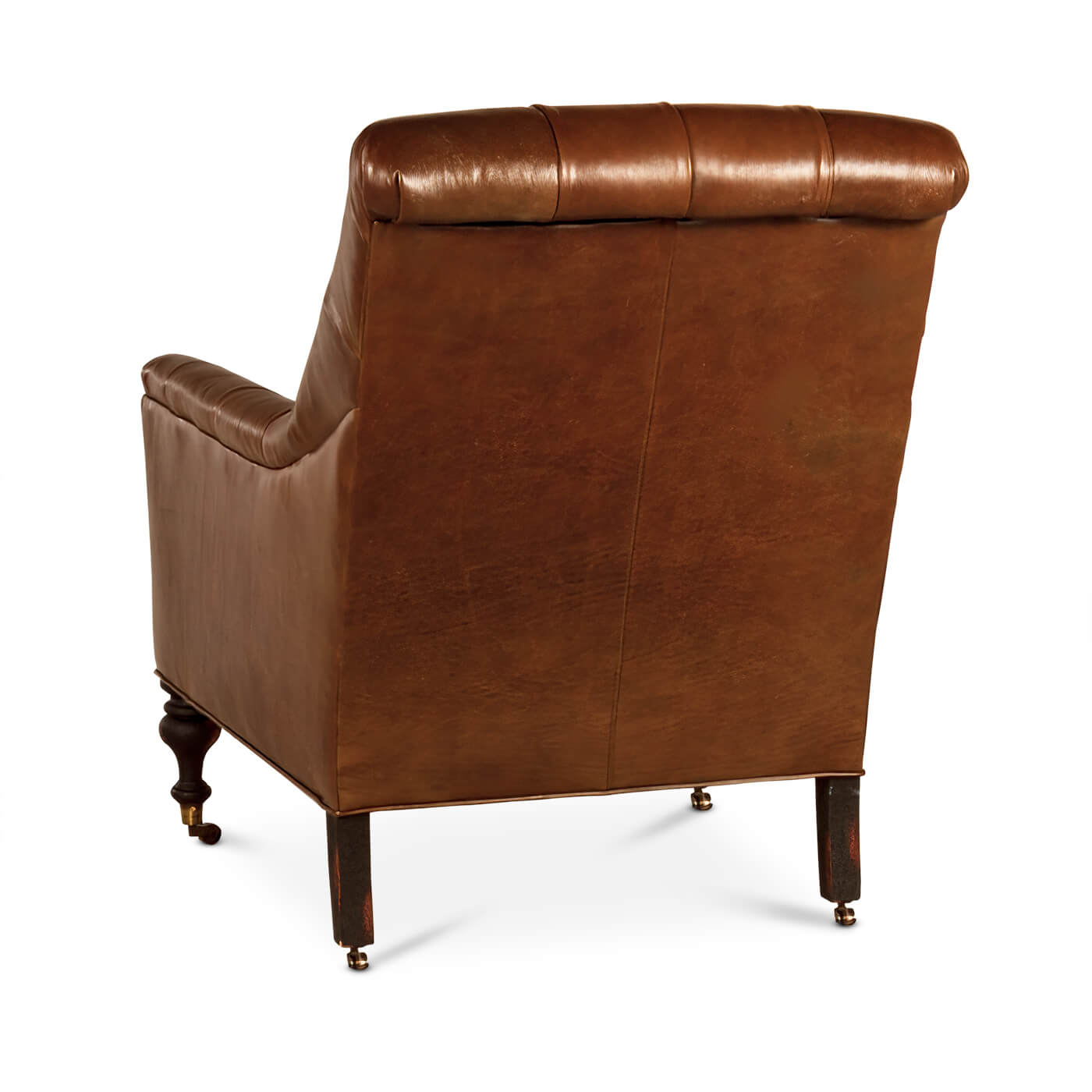 Back view of leather tufted club chair, wooden legs.