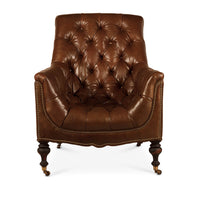 Front view of tufted leather club chair, elegant design.