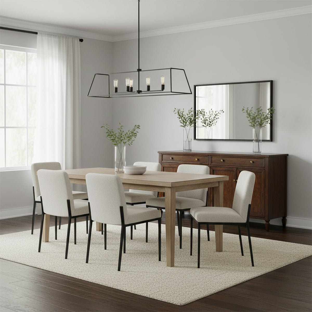 Dining room with sideboard, table, chairs, and chandelier.