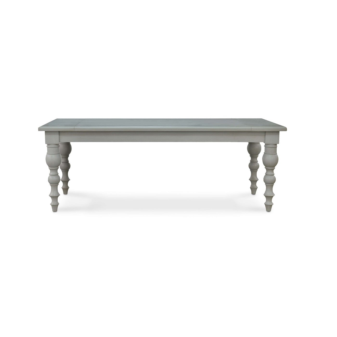 Front view of grey farmhouse dining table, turned legs.
