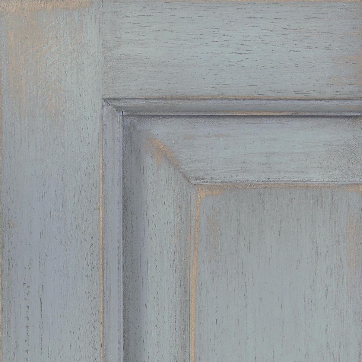 Close-up of grey wood texture on farmhouse dining table.
