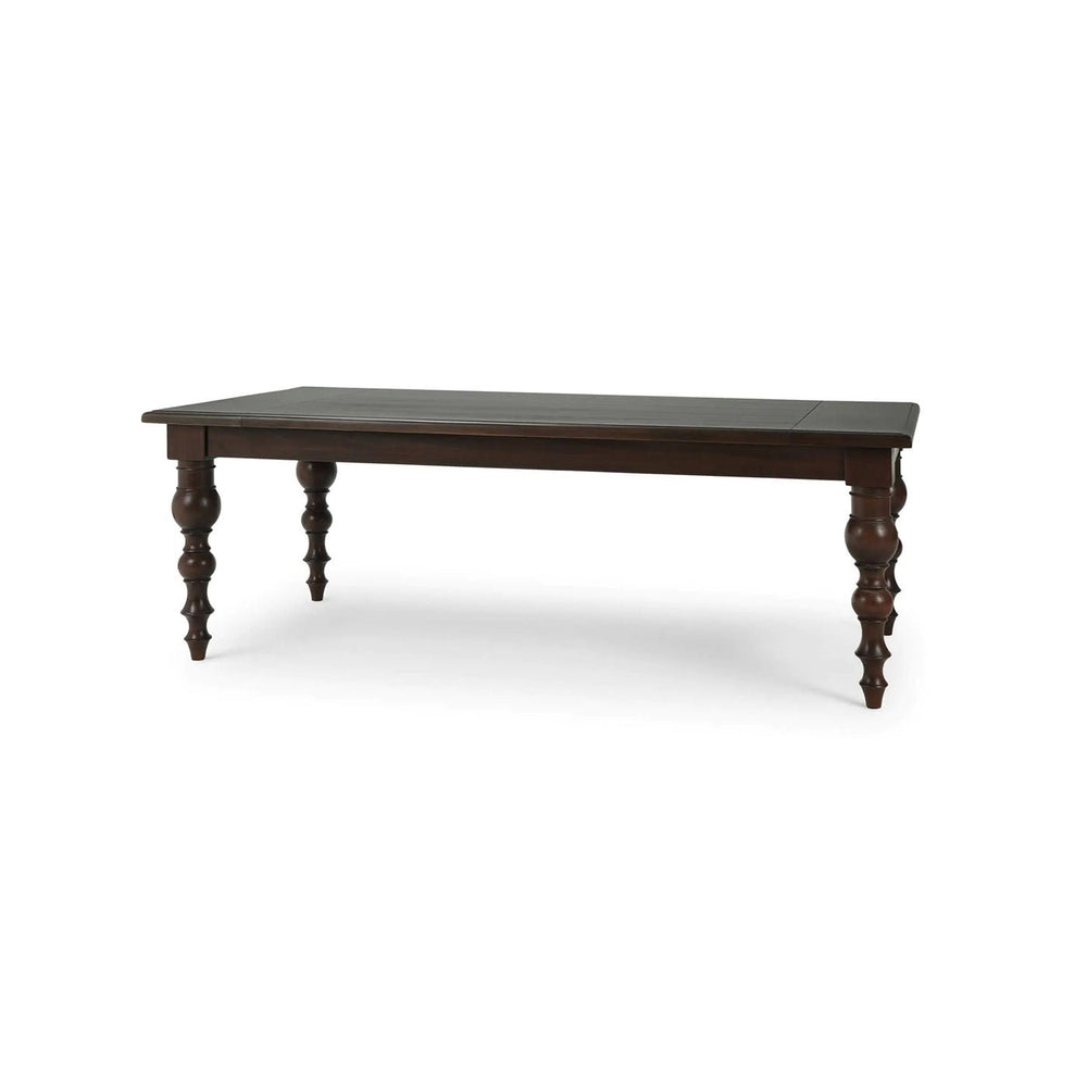Dark wooden dining table front corner view.