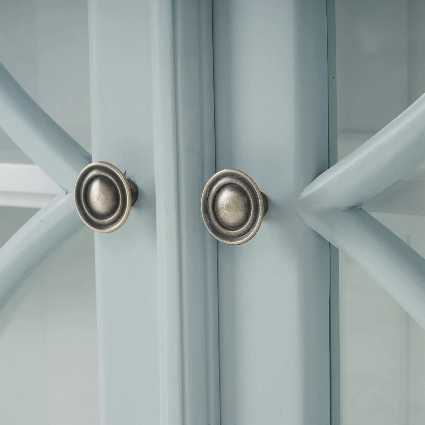 Close-up of credenza handles and door design.