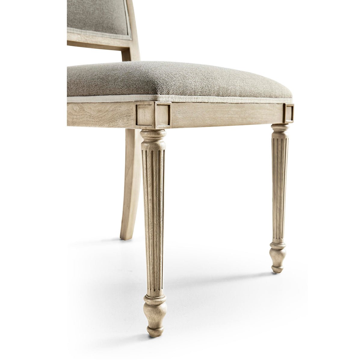 Detail of carved legs on classic French dining chair.