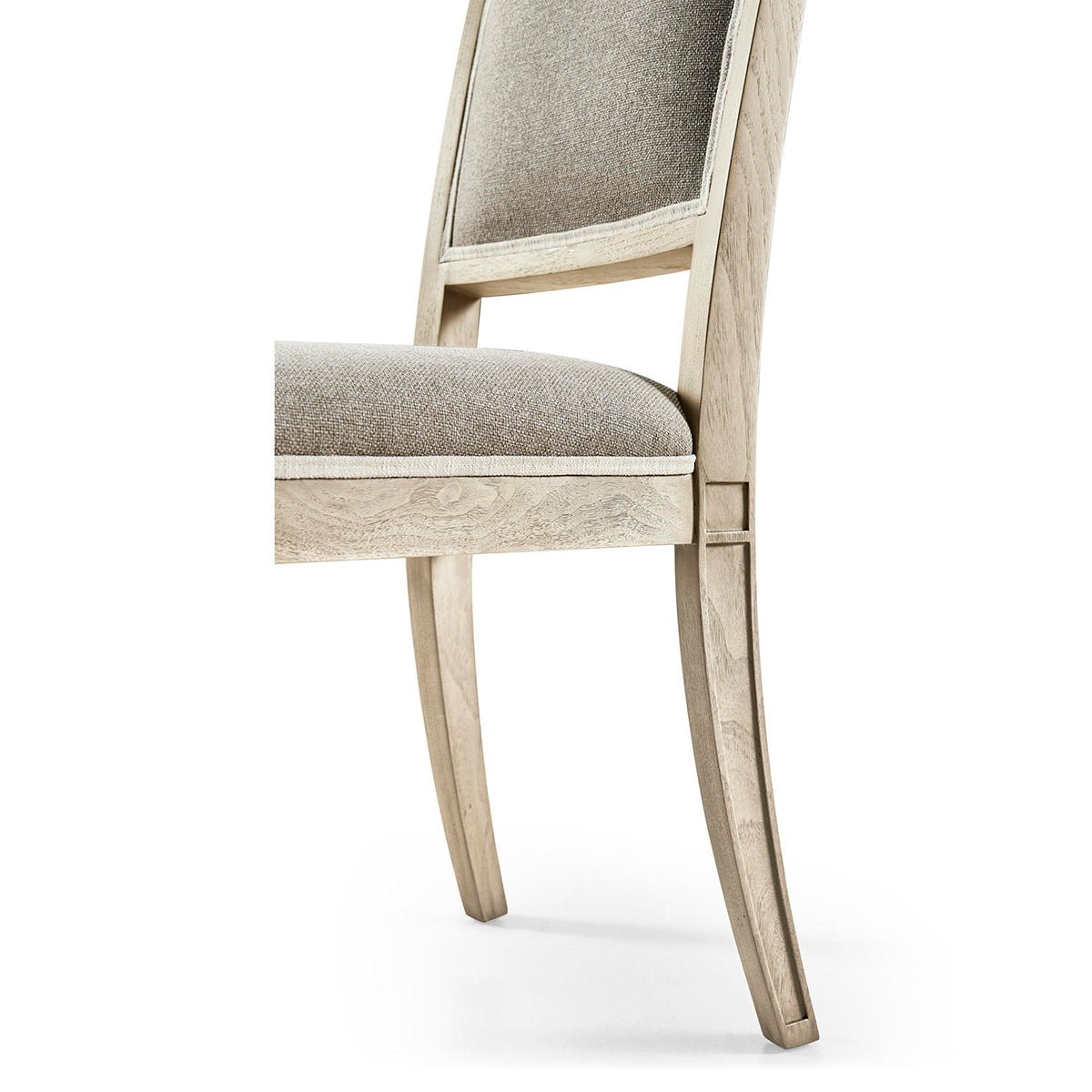 Close-up side view of classic French dining chair frame.