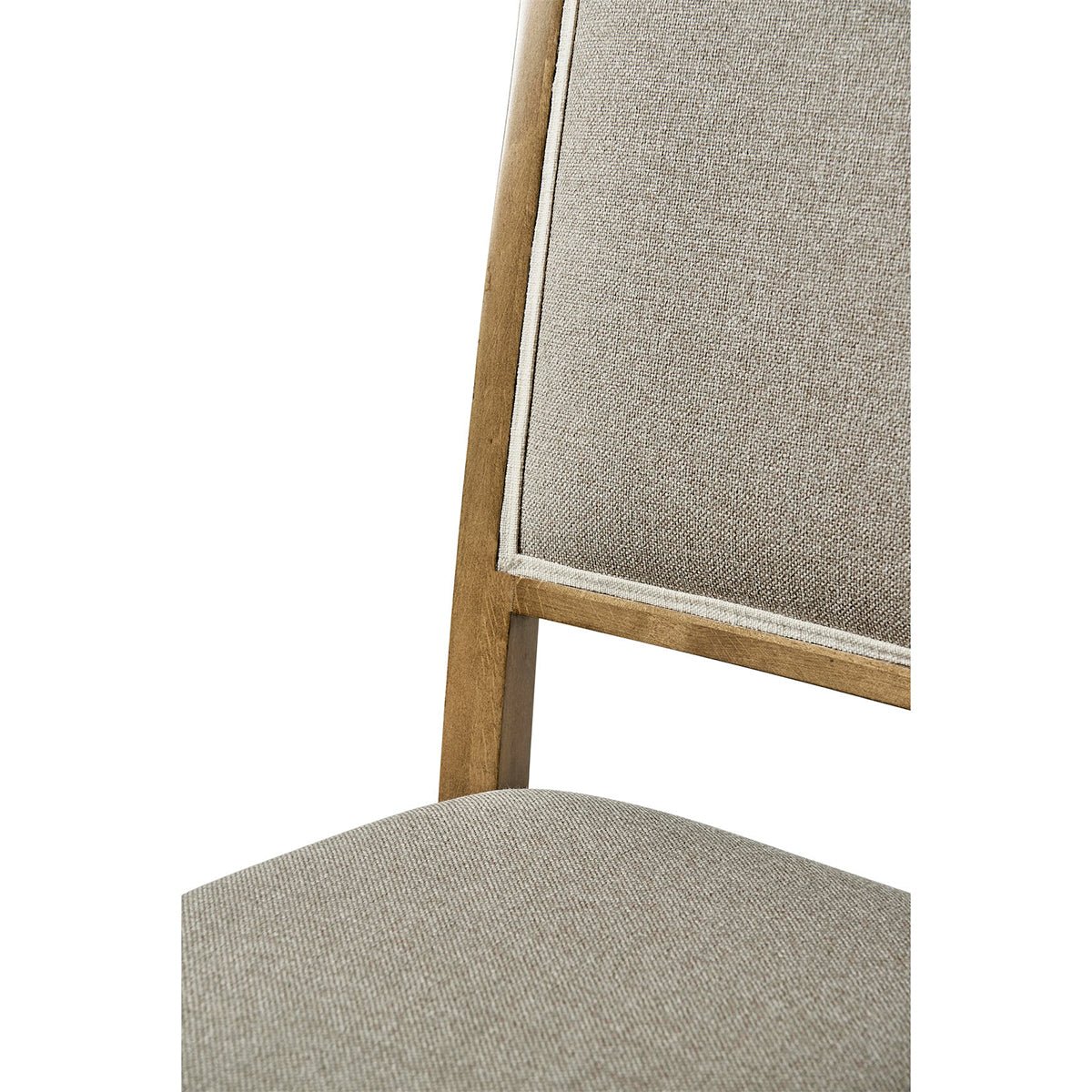Close-up of dining chair seat, cherry finish.