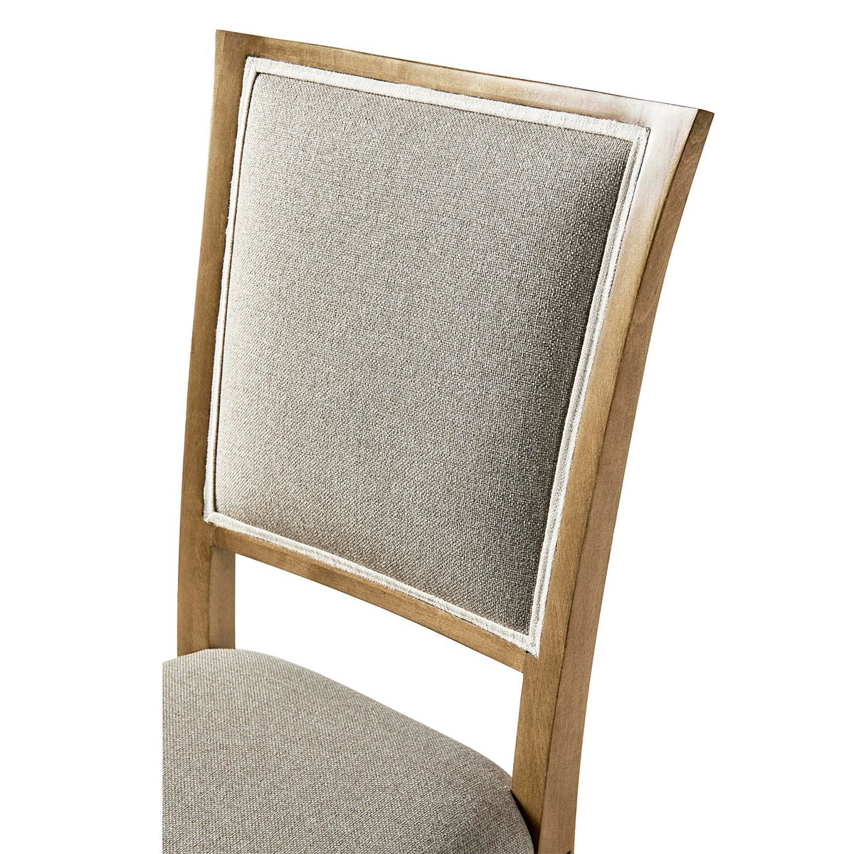 Close-up of dining chair backrest, cherry finish.