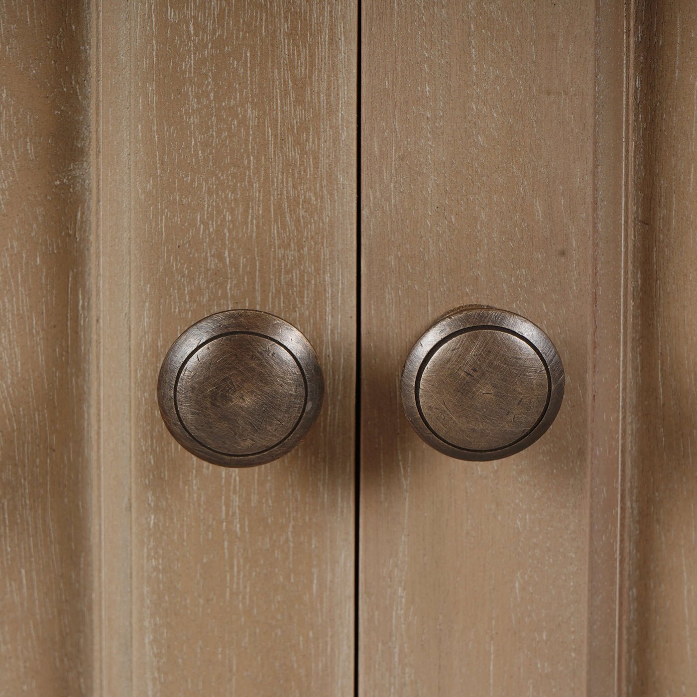 Close-up of knobs on classic French small credenza