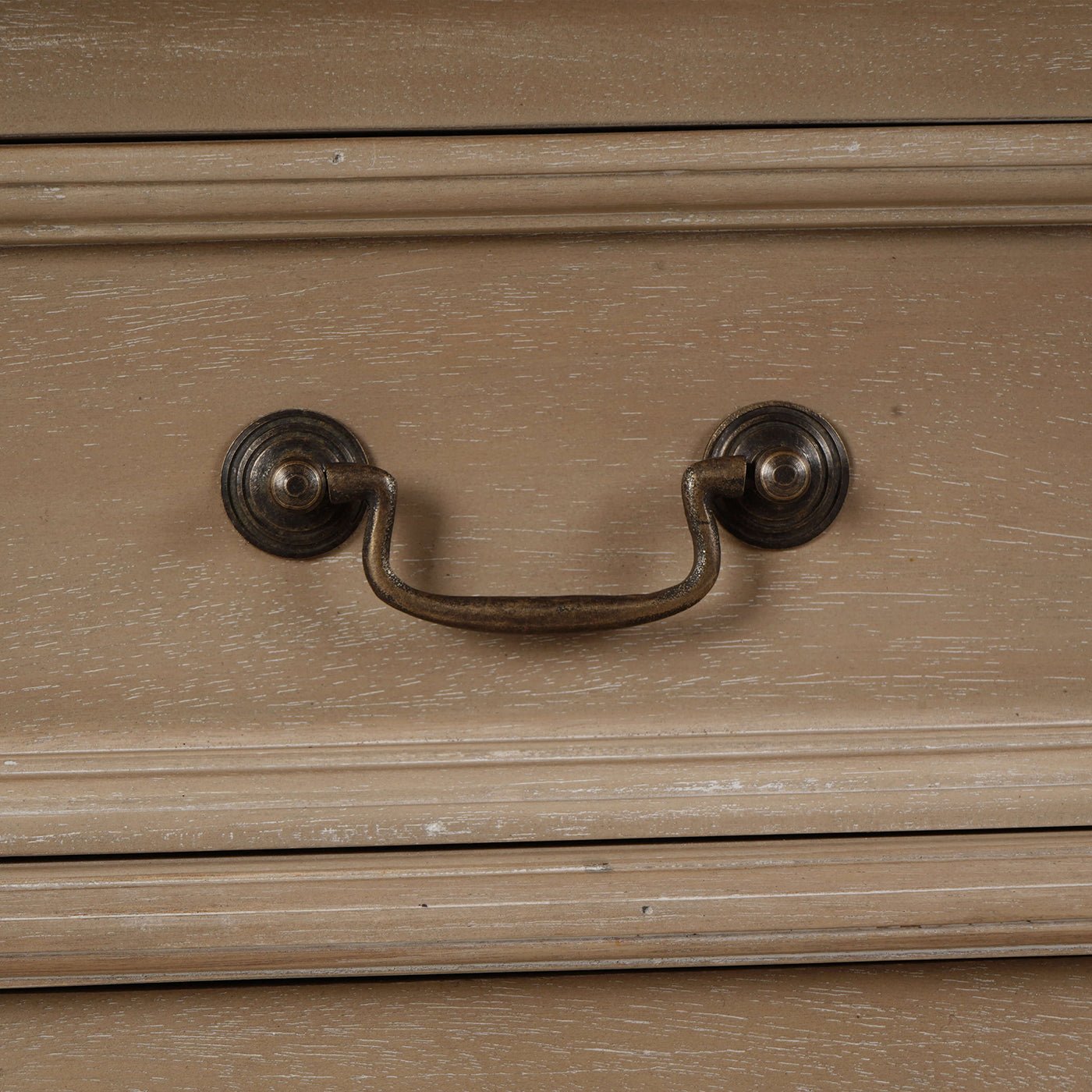 Close-up of handle on classic French small credenza drawer