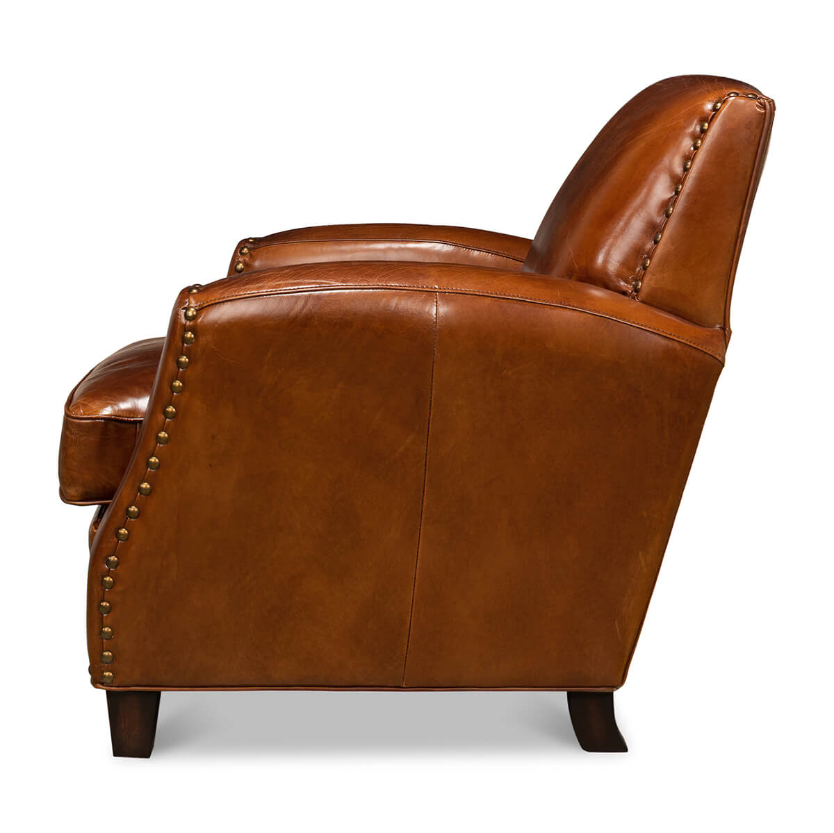 Side profile of brown leather armchair with trim.